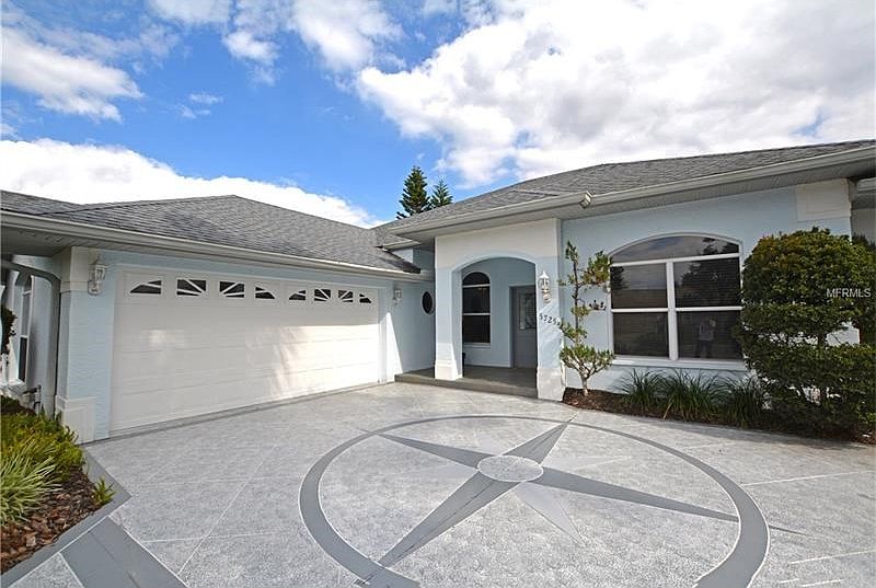 Fabulous curb appeal with 2-car garage and upgraded driveway.