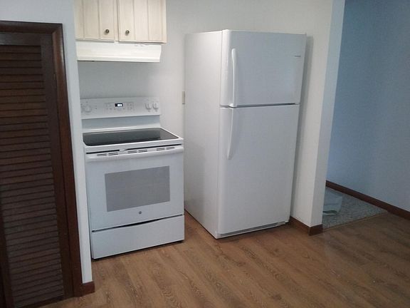 new electric range and refrigerator. Lessee maintains after