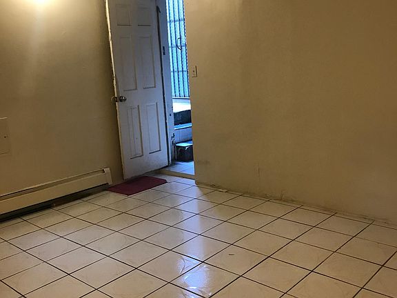 living room view 2 w/ entrance (please disregard poor camera/lighting)