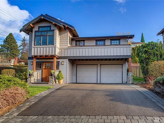 Two car garage, welcoming oak door,  covered  entry!