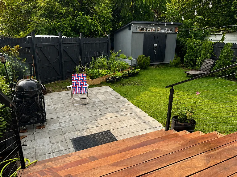 Patio off deck provides grilling space and leads to off street parking spot with a locking gate that's keyed to the house.