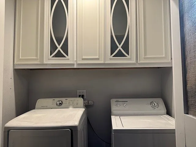 On-site laundry with storage cabinets