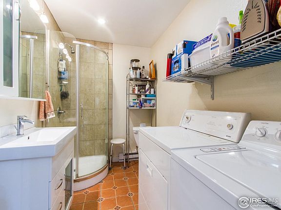bathroom off kitchen with laundry