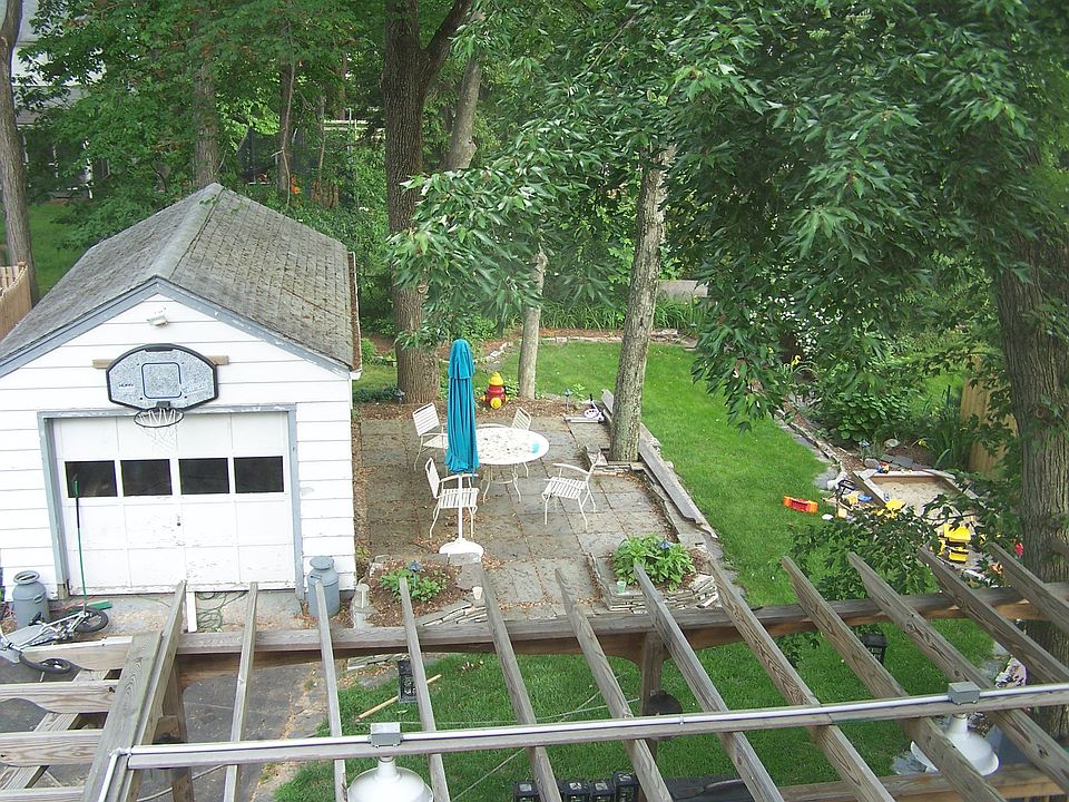 pergola covered deck,bluestone patio