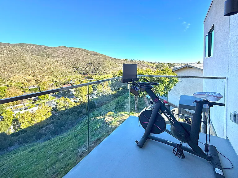 balcony with mountain and peekaboo ocean view