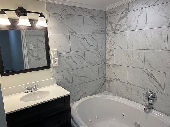 Tile and jetted tub, standup shower, master bathroom