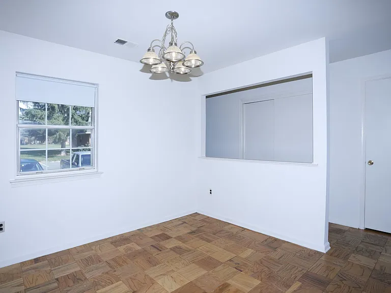Looking from Dining Room thru to entry hall area.