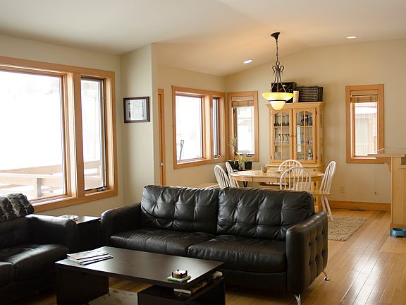 Living Room and Dining area--kitchen is to the right of dining. To the left are the windows offering unobstructed views of the Mt. Werner ski area; step out to the deck.