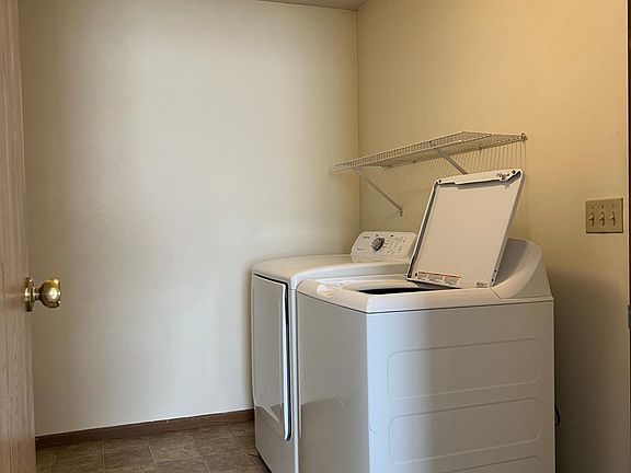 Laundry room off with entrance to the garage. W/D included.