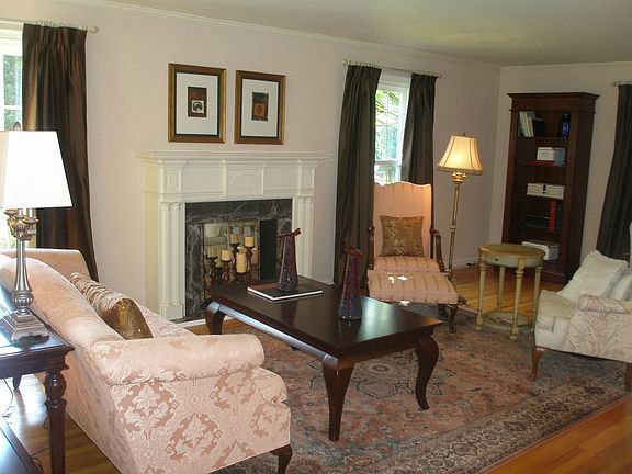 Large formal living room with hardwoods & faux fireplace
