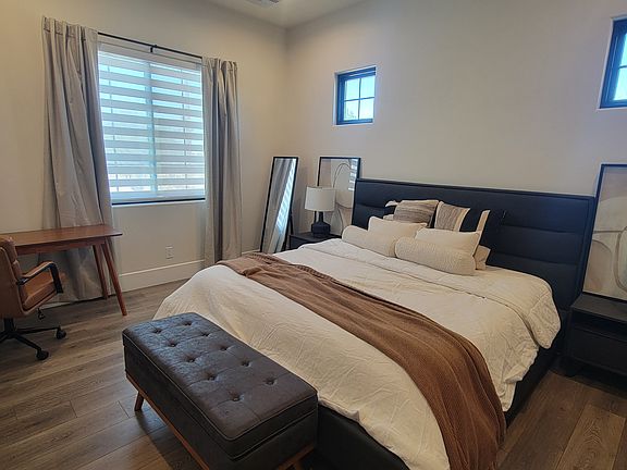 bedroom, king size bed, office desk, motorized shades, large reach in closet