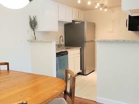 New lighting, flooring, and stainless steel appliances