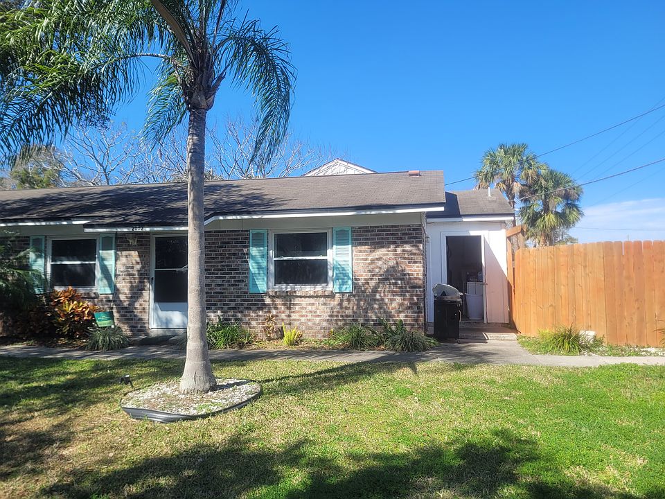 Landscaped front yard and privacy fence.