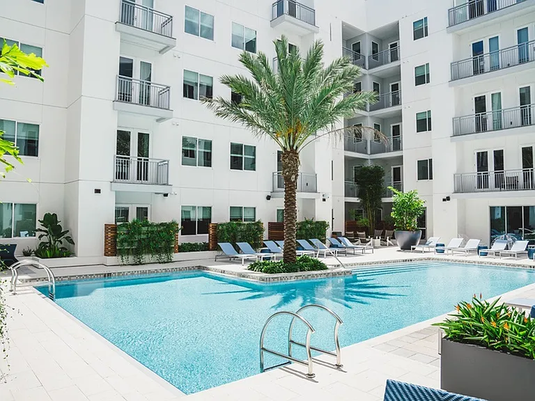 Escape to the Resort-Style Pool Courtyard with Firepit, Outdoor Games & Adjacent Social Lounge with HDTV