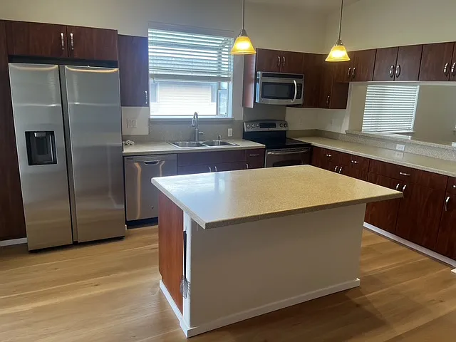 Large open concept kitchen with garden window