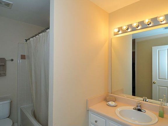 Bath has shower/tub combination and one of the two walk-in closets.