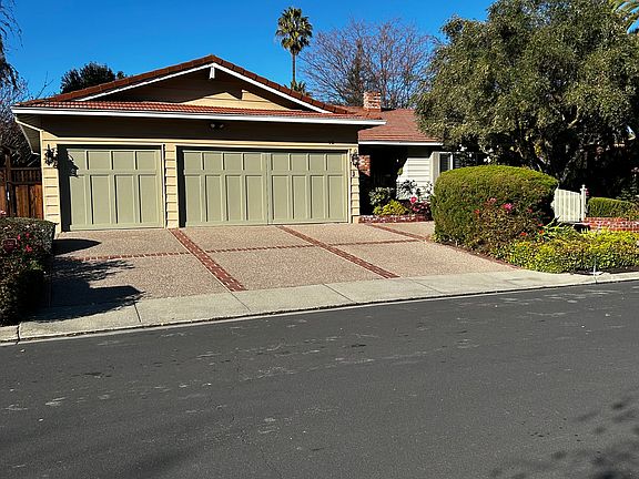 Large 3-car driveway brick, aggregate driveway.