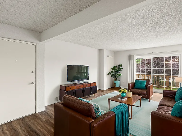Experience relaxation in this stylish and cozy living room, perfect for entertaining and unwinding.