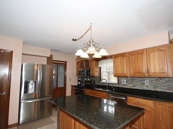 Large Eat In Kitchen : New Granite counter tops and stainless steel appliances.