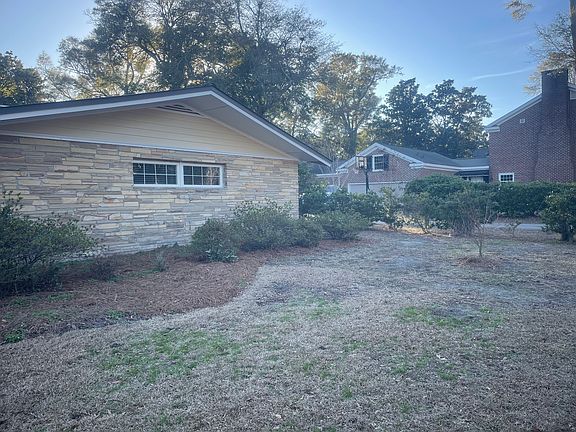 Front of house showing bedroom windows to primary bedroom