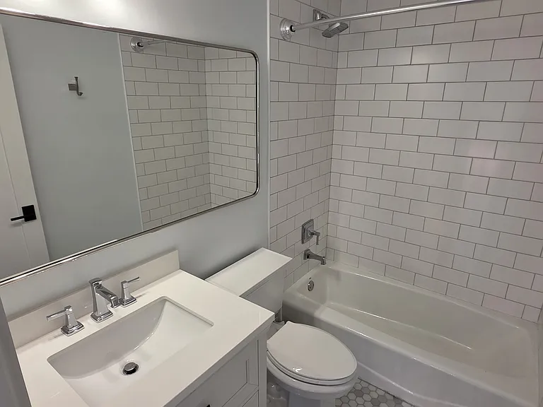 Upper floor common hallway bathroom.