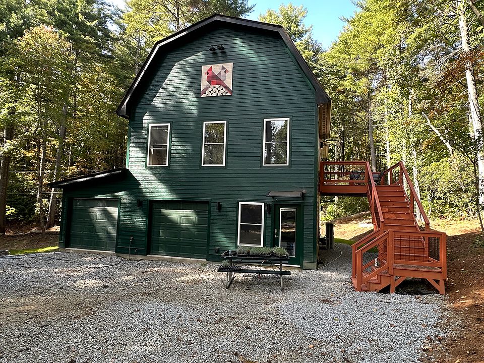 Parking and stairway to entrance. BBQ grill and picnic table.