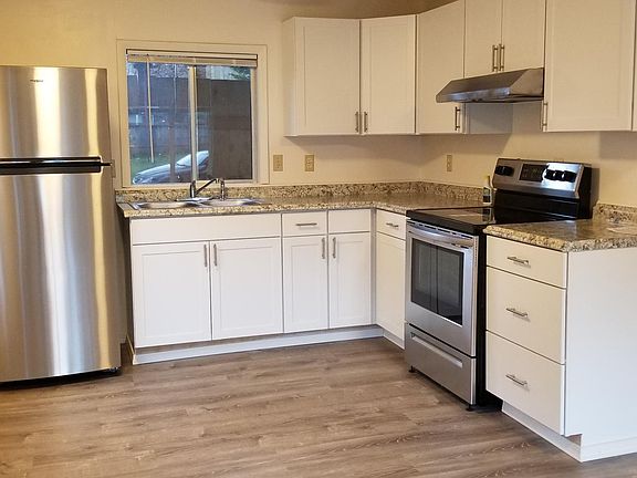 New kitchen Stainless frig and glass top stove