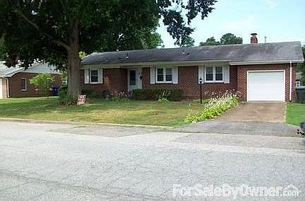Front view of the House
						:
						Double pane Windows and one car garage.