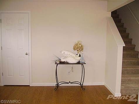 Foyer with gleaming wood floors