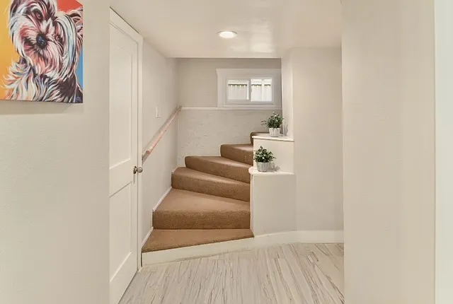 Enter the cozy basement quarters (3 bedrooms, one full bath, one half bath with laundry!)