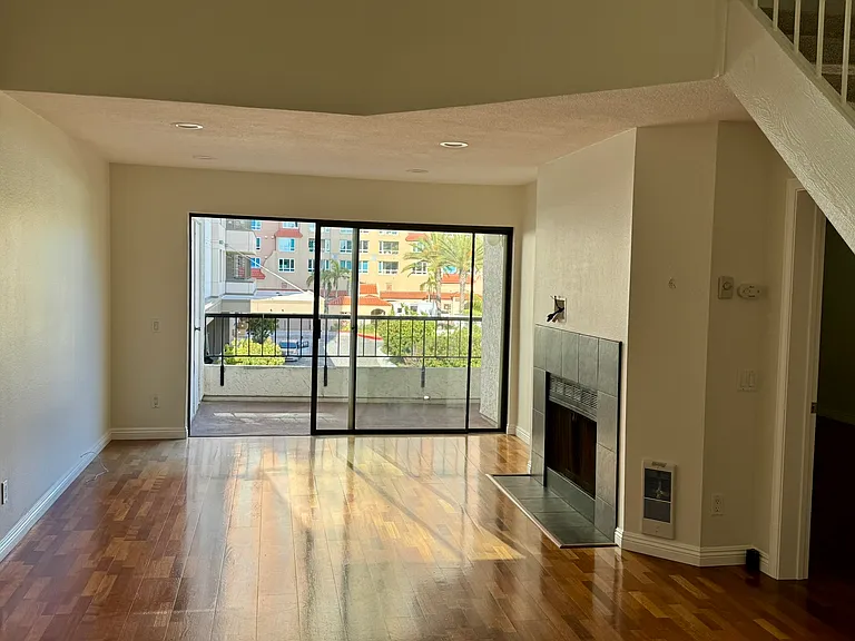 Living room, fireplace and balcony.