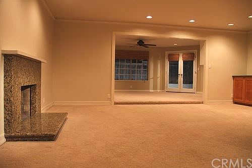 Spacious living room with bonus room that overlooks the back