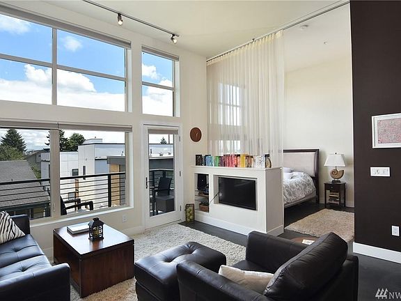 Living room with giant windows that fill the room with natural light.