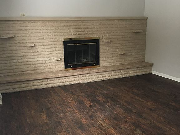 Living Room with Wood Burning Fireplace