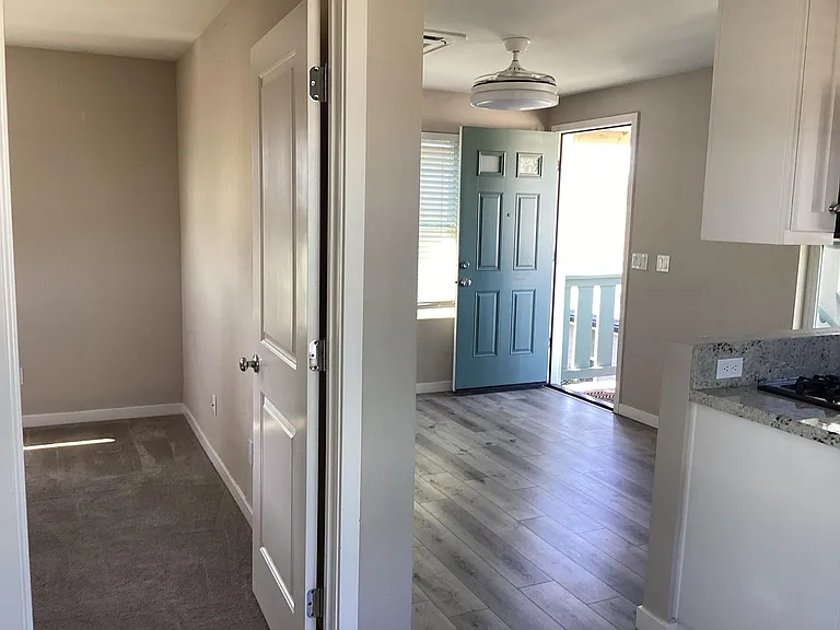 Looking at living room and bedroom from dining nook