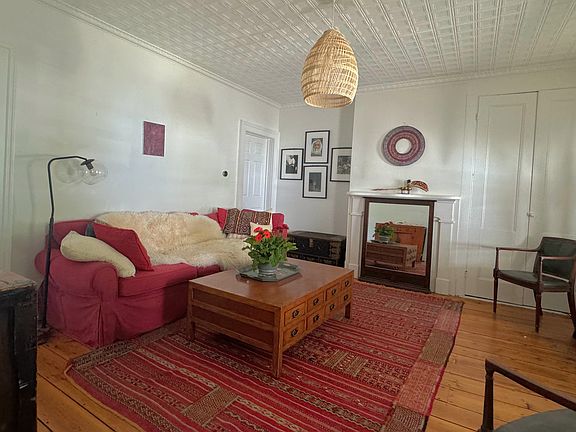 The living room is decorated with treasure from travels abroad.