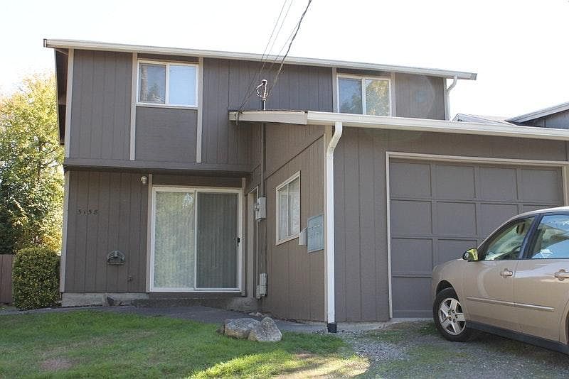 Front of home. 3 off street parking spaces and a 1 car garage.