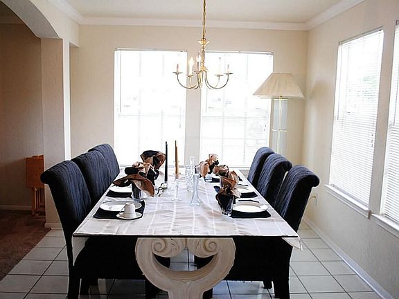 The formal dining room is just off the kitchen with a large window letting in lots of natural light.