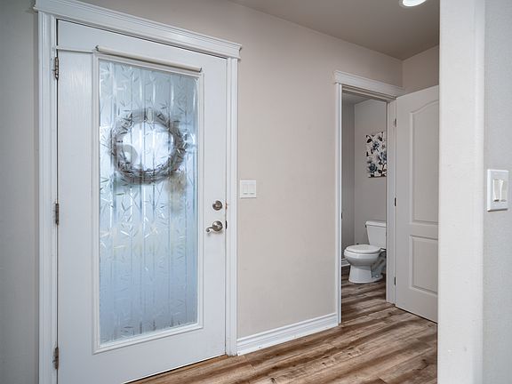 Half bath located by front entrance.