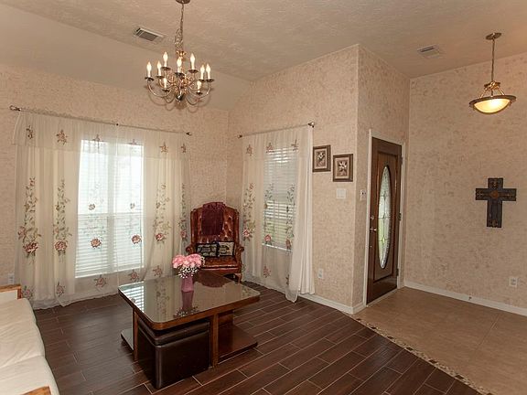 A flexible space off the entry can be a formal dining or a formal living room...