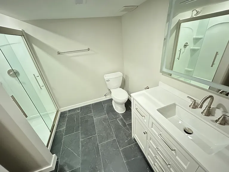 Lower level bath with shower.