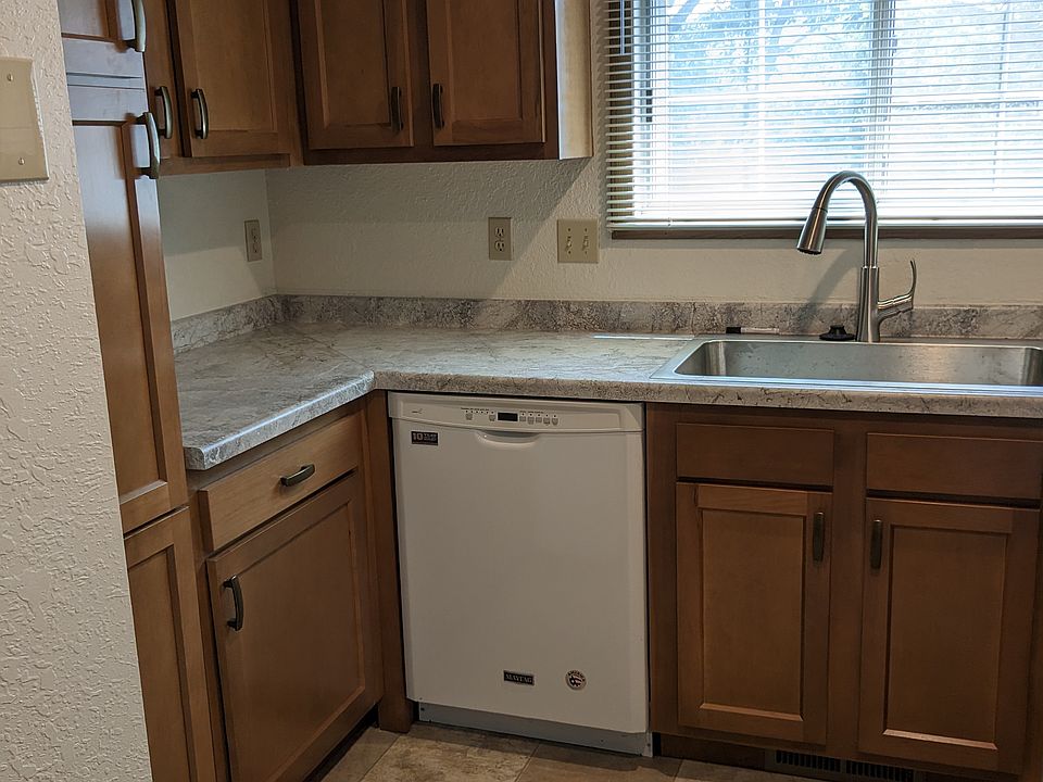 Previously rehab'd kitchen. It will look very similar to this layout but be just a slightly different color. There is no kitchen window in this unit.
