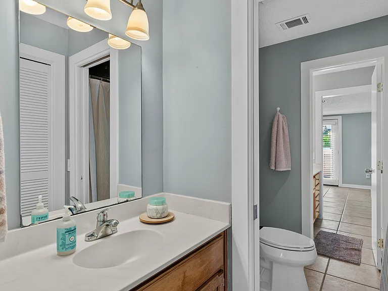 Jack and Jill bathroom with separate sinks for each bedroom