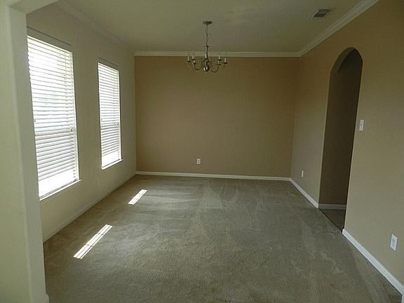 Large Den with High Ceilings & wall of Windows!