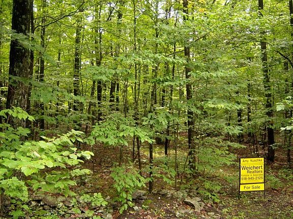 looking at property and rock wall