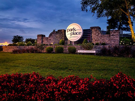 Community entrance sign at dusk