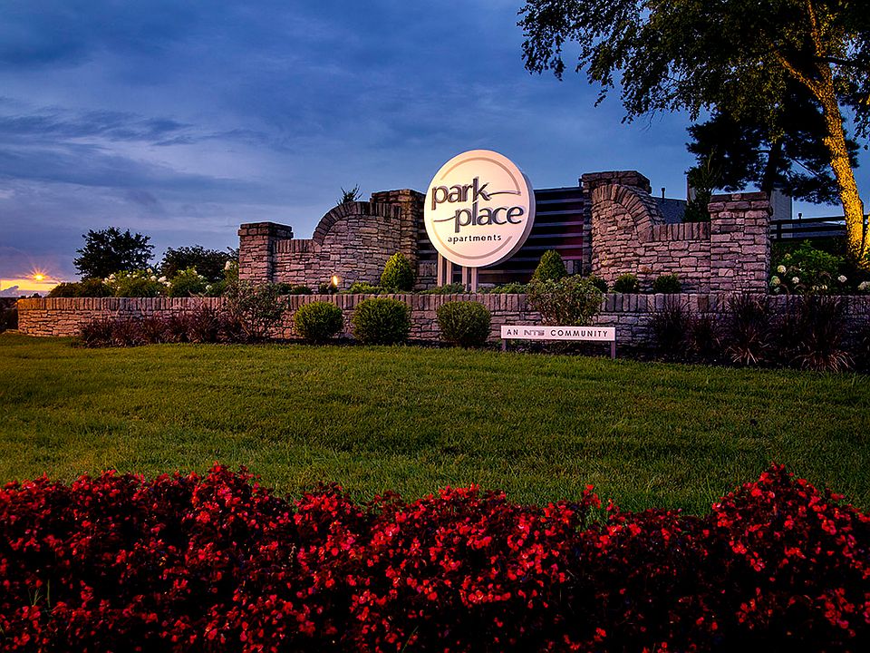 Community entrance sign at dusk