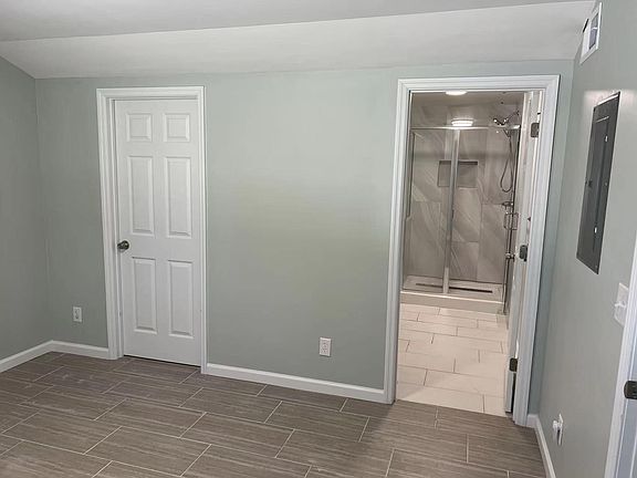 Bedroom with Walk-in Closet (left) and Bathroom (right)