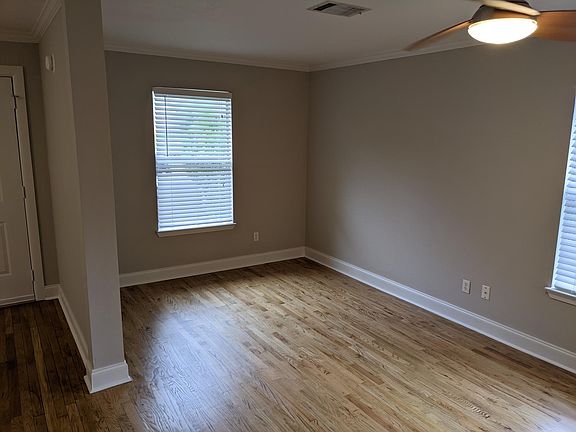 This nook is connected to the main living area and could be used as a dining area, play area for the kids, or workout space.