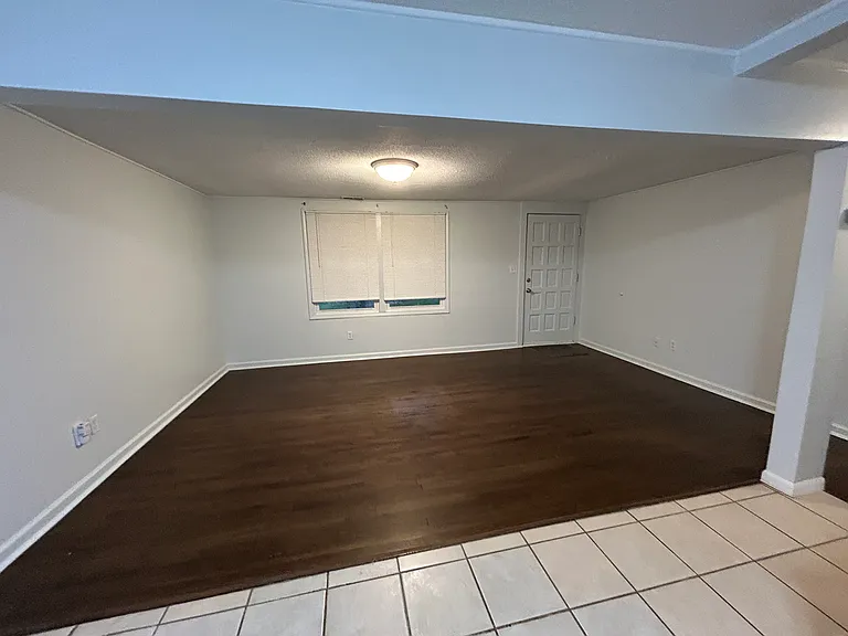 View from kitchen at living room and front door.